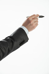 Businessman's hand writing something on a white wall