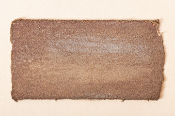 a piece of old cloth on a background of paper