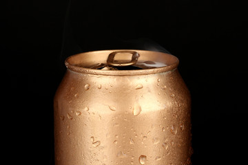 Aluminum can with water drops isolated on black