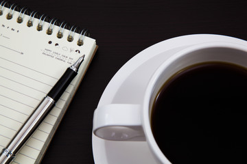 Cup of coffee and book