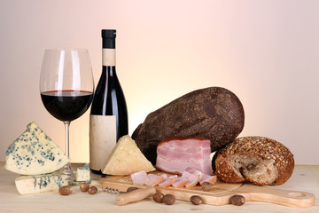Exquisite still life of wine, cheese and meat products