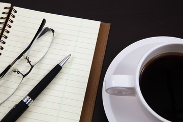 Cup of coffee and book