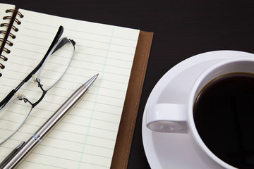 Cup of coffee and book