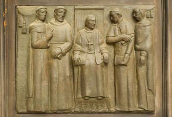 Fototapeta na wymiar Bas-relief on the church Saints Gervasio and Protasio Protasio