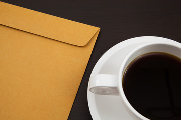 Obraz na płótnie Canvas Cup of coffee and paper