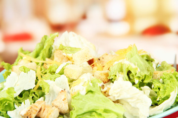 Caesar salad, close up, on bright background