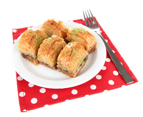 Sweet baklava on plate isolated on white