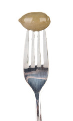 Canned plum sticking on fork, isolated on white