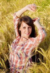 Pretty brunette in a field