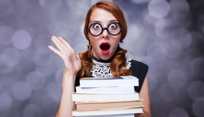 Surprised girl with books