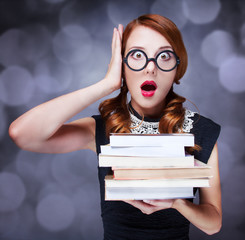 Surprised girl with books