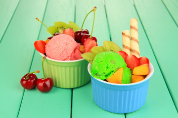 Delicious  ice cream with fruits and berries in bowl