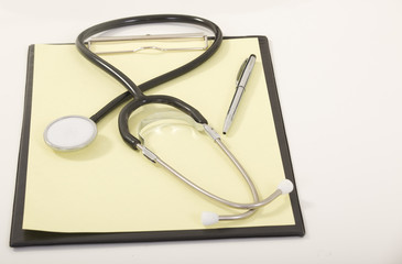 Medical Stethoscope with Pen on Medical File Folders