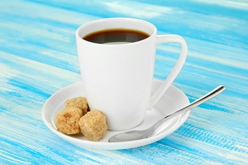 Cup of coffee, on color wooden background