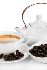 Cup of berry tea isolated on white