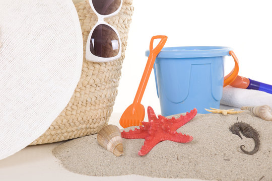 beach bag with toys and sunglasses for the whole family