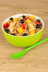 Oatmeal with fruits on table close-up