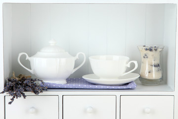 Fototapeta premium Still life with glass of lavender sugar, cup and fresh lavender