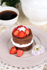 Chocolate cake with strawberry on table close-up