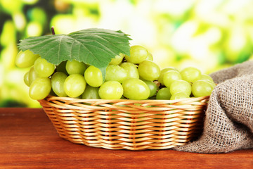 Ripe delicious grapes in wicker basket