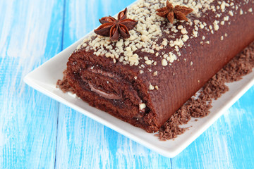 Sweet roll on plate on table close-up
