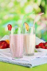 Delicious milk shakes with strawberries and peach