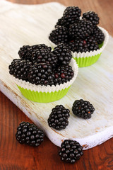 Sweet blackberry on wooden table