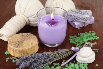 Obraz na płótnie Canvas Still life with lavender candle, soap, massage balls, bottles,
