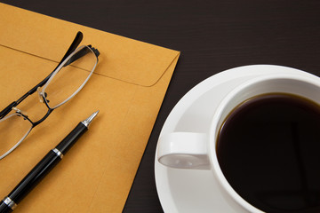 Cup of coffee and paper