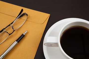 Cup of coffee and paper