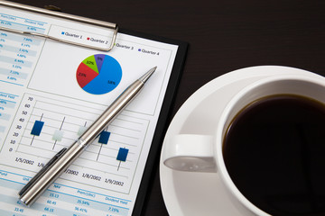 Business report and cup of coffee