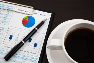 Business report and cup of coffee