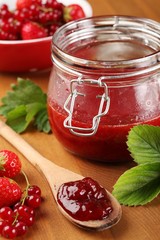 Strawberry jam and berry fruits