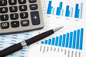 Financial paper charts and graphs