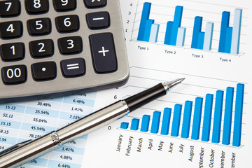 Financial paper charts and graphs