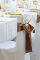Fototapeta na wymiar wedding chair with silk ribbon