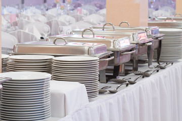 metal kitchen equipments on the table for fine wedding dining