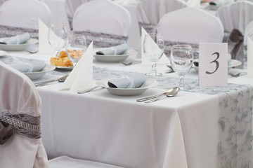 decorated chairs and wedding table number three