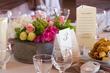 table set for wedding dinner decorated with flowers