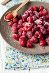 fresh ripe raspberries on a plate