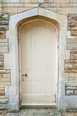 Fototapeta na wymiar Old external door in a stone wall