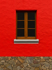 rote Mauer mit Bruchsteinsockel und Holzfenster