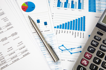 Financial paper charts and graphs