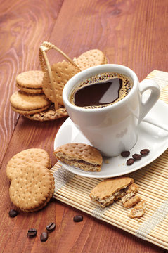 Cup of coffee and sweet cookies