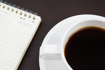 Cup of coffee and book