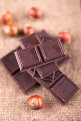 chocolate bar and cobnut on a gunny background