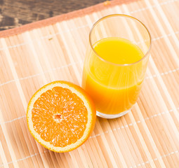 orange and a glass of orange juice