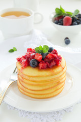 Pancakes with summer berries: strawberries, blueberries.