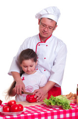 Father and daughter cooking together