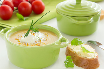 Pumpkin cream soup with thyme and cream.